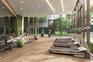 a gym with a bunch of exercise equipment in a building at Eden D condo reefB244 in Kathu