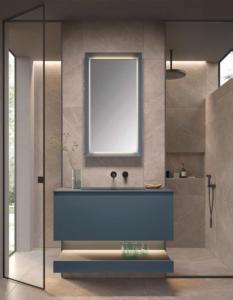 a bathroom with a blue sink and a window at Wieshof Wilder Kaiser by ALPS RESORTS in Söll