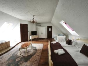 a large living room with a couch and a table at Lesence Major in Lesencetomaj +66 photos