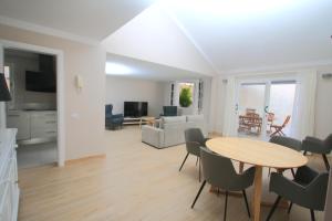 a living room with a table and a couch at Villa Santiago in La Playa de Tauro