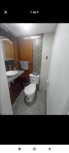 a bathroom with a toilet and a sink at Mini suit in Loja