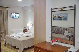 Кровать или кровати в номере Treanto Nafpaktos Boutique Hotel