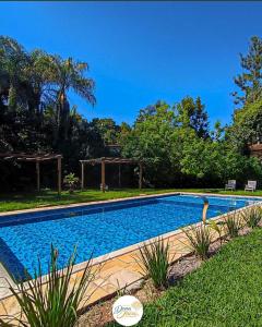 a swimming pool in the yard of a house at Villa Dona Jaca - Cabana 2 in Socorro