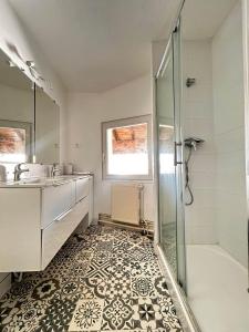 a bathroom with a shower and a sink at Maison Duplex Collection, in Limoges +56 photos