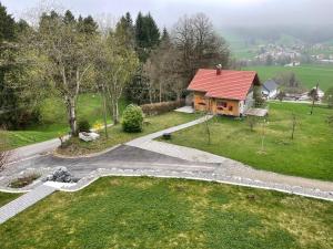 an aerial view of a house with a red roof at Ferienhaus Talblick in Weiler-Simmerberg