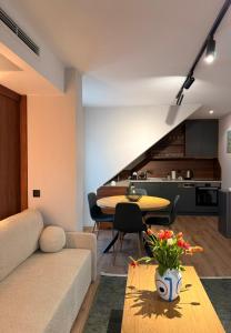 a living room with a couch and a table at Vip Stay in Gotse Delchev