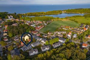 an overhead view of a suburb with a blue circle at FeHa Windspiel in Loddin
