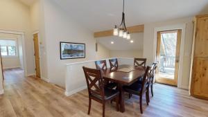 a dining room with a table and chairs at 1 Fifteenth Tee Lane in Sunriver +21 photos