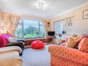 a living room with two couches and a large window at 4 Bed in Wigton oc-sz384 in Bothel
