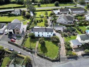 arial view of a house in a residential neighborhood at 4 Bed in Wigton oc-sz384 in Bothel