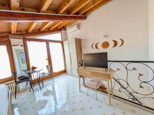 a living room with a piano and a table at Al Castello B&B in Eboli