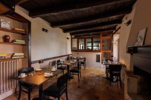 a restaurant with tables and chairs in a room at Casa Delicato - B&B - Camere - Ospitalità in Contigliano