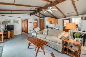 a living room with a couch and a table at Steps to St Albans Bay! Basecamp w/ Grill in Saint Albans Bay