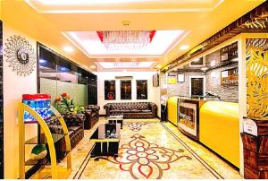 a living room with a couch and a table at N S International in Kolkata