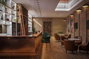 a restaurant with a bar with chairs and tables at 3br - PoolAccess - 7 MinstoDubai Mall - 2 KingBeds in Dubai