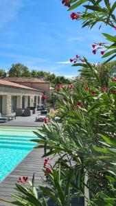 a villa with a swimming pool and a resort at La Fompatoise in Vérines