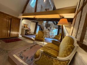 a large living room with a couch and chairs at Our Hippie Castle Vianden - Unique Bohemian Guesthouse in Vianden