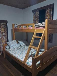 a bedroom with two bunk beds in a room at Hotel Anjara in Ambositra