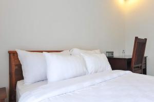 Letto o letti in una camera di UmahOde Bali