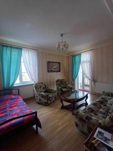 a living room with a couch and a table at MERE Apartment in Sillamäe