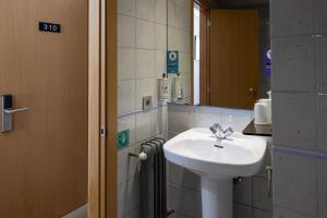 a bathroom with a sink and a mirror at Alda Centro Palencia in Palencia +66 photos