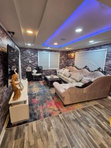a living room with a couch and a table at Berwyn Alimot Proshortlet-home LLC in Syracuse