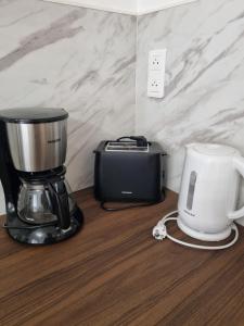 a blender and a toaster sitting on a counter at Harmonie in Monteux
