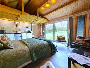 a bedroom with a large bed in a wooden room at 1 Bed in Maryport oc-96373 in Dearham