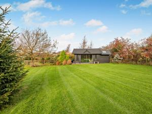 a house in a field with a large yard at 1 Bed in Maryport oc-96373 in Dearham