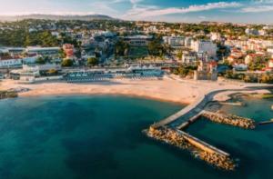 an aerial view of a beach in a city at Estoril by the Sea in Estoril