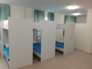 a room with two bunk beds in it at Atom hostel for men in Astana