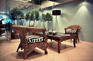 two chairs and a coffee table in a store at Ortegal Urban Suites in Mar del Plata