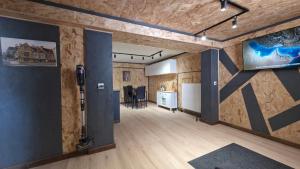 a large room with wooden walls and wooden floors at Chambre d'hôtes MA DAME in Clérey