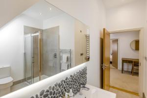 a bathroom with a shower and a sink and a toilet at 5 Bed in Walberswick oc-hlwal in Walberswick +36 photos