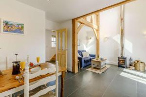 a living room with a sink and a fireplace at 1 Bed in Helston oc-82496 in Ruan Minor