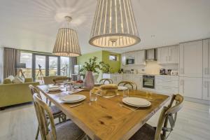 a kitchen and dining room with a wooden table and chairs at 3 Bed in Dunwich oc-slh in Dunwich