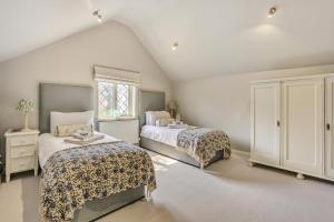 a bedroom with two beds and a window at 3 Bed in Dunwich oc-slh in Dunwich