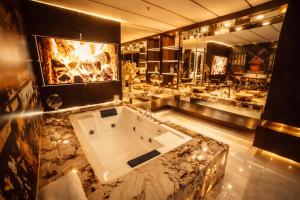 a large bathroom with a large tub in the middle at 1Million Suites in Medellín +80 photos