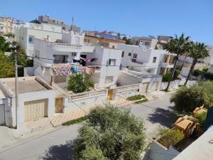 an aerial view of a city with white buildings at Studio ANDALOUS in Mahdia