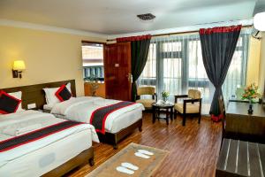 Postel nebo postele na pokoji v ubytování Taleju Boutique Hotel