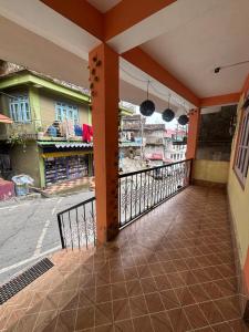 a balcony with a view of a street at Shivaay Inn in Lava