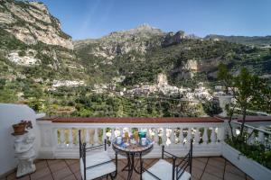 a balcony with a view of the mountains at Villa Palumbo in Positano