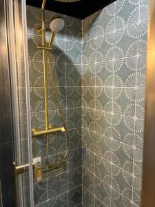 a shower in a bathroom with a wall at Blue dream in Carantec +30 photos