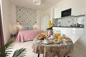 a living room with a table with food on it at Villa Raf in Vico Equense +36 photos