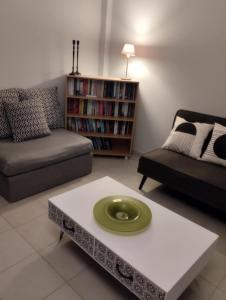 a living room with a couch and a coffee table at Kalli's View in Evdilos
