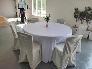 a white table and chairs in a room at Green Forest Resort in Setiu