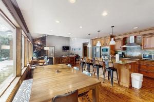 a large kitchen with a wooden table and chairs at Leavenworth Mountain, Golf Course, 3br 4 ba in Leavenworth