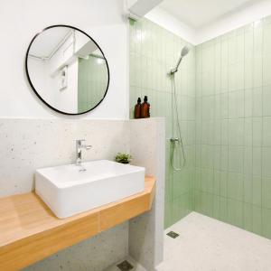 a bathroom with a sink and a mirror at 8 Min Walk to IconSiam I BTS near Pier in Bangkok