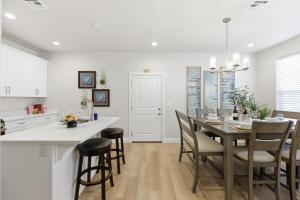 a kitchen and dining room with a table and chairs at The Treehouse in Escondido in Washington