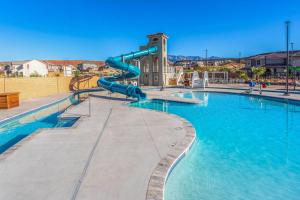 a large swimming pool with a water slide at The Treehouse in Escondido in Washington